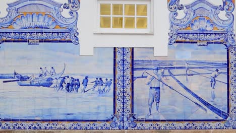 Aveiro's-train-station-showcases-blue-tiles-depicting-historic-maritime-trades,-including-Moliceiro-boats-and-saltwork