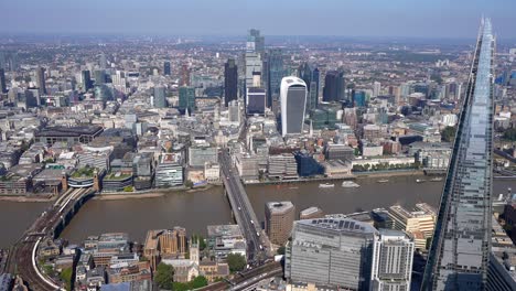 Aerial-view-of-the-South-Bank-from-London-Bridge-showing-a-City-View,-the-Shard-and-the-Tower-of-London-and-Tower-Bridge