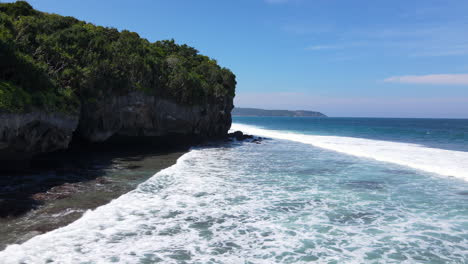 White-Foamy-Waves-Coming-To-The-Shoreline-And-Cliffs-In-Sumba-Island,-Indonesia