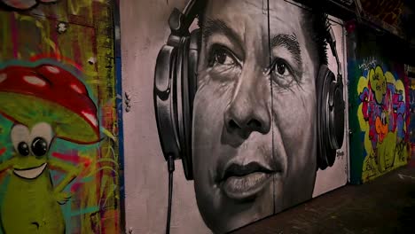 Look-up-and-think-while-listening-to-the-music,-The-Graffiti-Tunnel,-Waterloo,-United-Kingdom