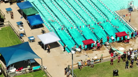 Bird's-eye-view-of-sporting-event-with-people-gathered-from-around-the-town