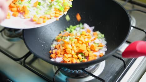Sauteing-Fresh-Chopped-Vegetables-In-Wok-Pan.-slowmo