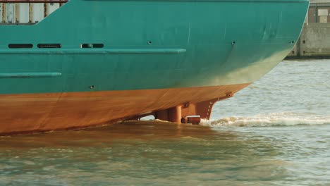 Ship-propeller-creating-prop-wash-underwater-of-massive-container-ship