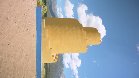 Timelapse-of-Crestone-Ziggurat-during-the-day-with-clouds,-Vertical