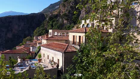 Tranquil-Mediterranean-Retreat:-Hillside-Resort-with-Infinity-Pool,-Veranda,-Sea-View-Village,-and-Exquisite-Stone-Architecture---Pure-Relaxation