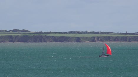 Colourful-yacht-at-speed-racing-on-a-windy-morning-at-Dunmore-East-Waterford-Ireland
