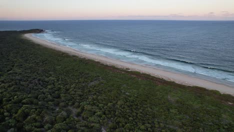 Beautiful-waves-from-Turners-Beach,-Australia-at-sunset---Aerial
