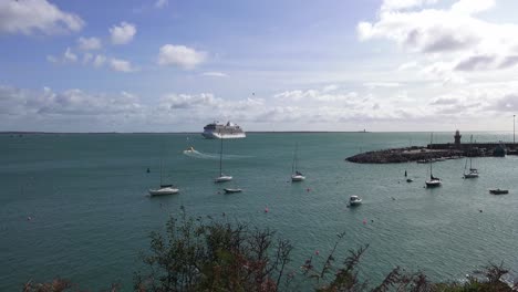 Dunmore-East-and-Hook-Head-Lighthouse-with-a-Cruise-Liner-anchored-in-the-Estuary-Autumn-afternoon