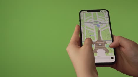 woman-looking-at-th-Eifffel-Tower-on-3D-map-on-phone