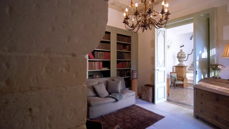 Slow-revealing-shot-of-an-antique-library-room-with-comfortable-furniture-and-fireplace