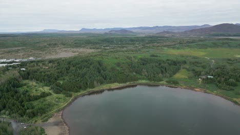 Aerial-view-of-Icelandic-landscape,-beautiful-lake-in-the-highlands