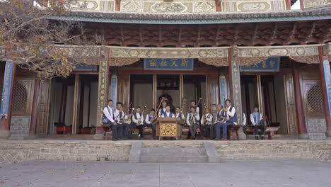 Bai-Minority-Group-Performing-Music-at-Chinese-Temple-in-Yunnan,-China