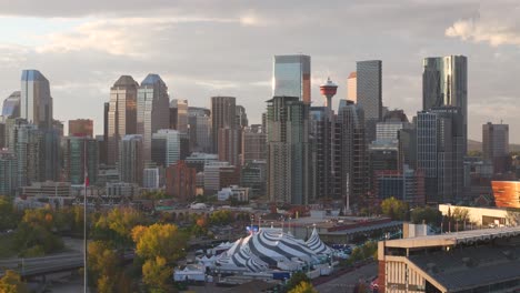 The-downtown-core-of-Calgary-Alberta-is-seen-from-a-aerial-drone-point-of-view-with-the-Stampede-grounds-in-the-foreground