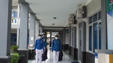 Male-students-or-cadets-of-the-Sailing-and-Maritime-Vocational-School-line-up-and-walk-to-class-via-the-school-terrace-to-attend-lessons-in-the-morning