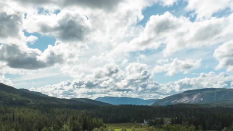 Cumulus-Clouds-Rolling-Over-Sunny-Sky-Of-Forest-And-Mountains
