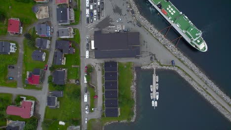 Aerial-top-down-view-of-the-overloaded-ferry-port-in-Gryllefjord-during-summer-season-on-Senja