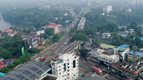 Aerial-view-of-Aluva-city,-Ernakulam-,kochi-metro-start-line-and-Marthanda-Varma-Bridge