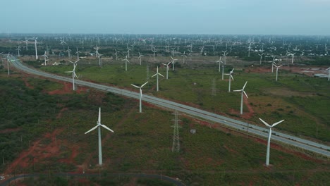 Beautiful-view-of-Windmills-or-Wind-Turbines-farm-in-Nagercoil,-South-India_-and-highwayroad-moving-shot