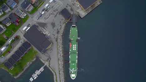 Cars-driving-on-the-ferry-at-Gryllefjord-port-during-busy-summer-season-to-get-to-Andenes,-Birds-Eye-view