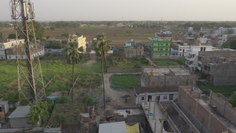 Rural-India-landscape,-concrete-buildings-and-farmland,-High-angle-view