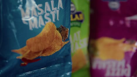 A-selection-of-products-in-an-Indian-supermarket-specifically-highlighting-a-variety-of-chips-and-snacks