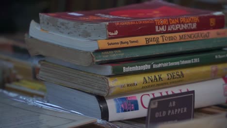 Close-up-of-a-stack-of-old-Indonesian-books