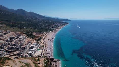 Resorts,-Residences,-and-Hotels-Emerge-on-Albania's-Seashore,-Embracing-the-Ionian-Deep-Blue-Sea---A-Thriving-Real-Estate-and-Holiday-Destination,-Touristic-Marvels