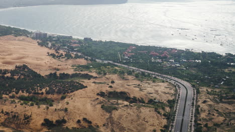 Majestic-highway-road-on-ocean-coastline-in-Vietnam,-aerial-view