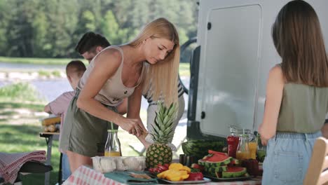Handheld-video-of-mother-and-daughter-preparing-food-for-picnic