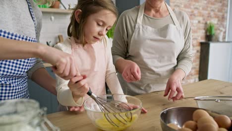 Handheld-video-of-girl-helping-in-the-kitchen