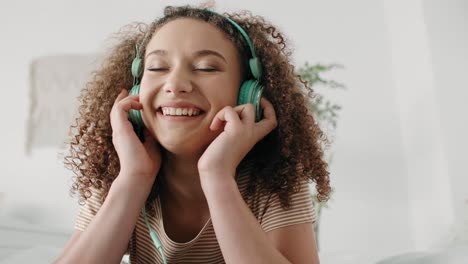 Teenage-girl-listening-to-music-and-dancing