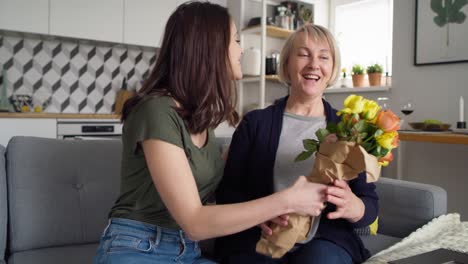 Handheld-video-of-daughter-giving-her-mother-flowers