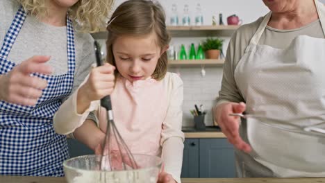 Video-of-girl-mixing-ingredients-in-a-bowl-for-Easter-cake