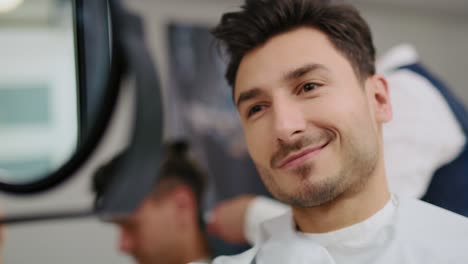 Handheld-video-shows-of-handsome-man-in-barbershop