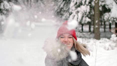 Girl-throwing-snowball-right-on-the-camera