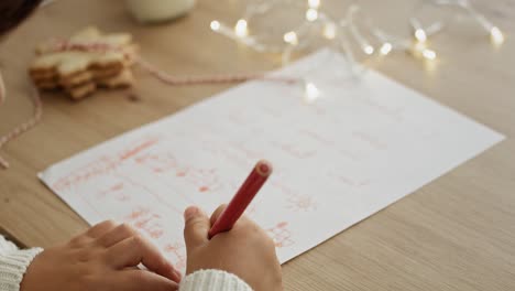Tilt-up-video-of-children-writing-creative-letters-to-Santa-Claus