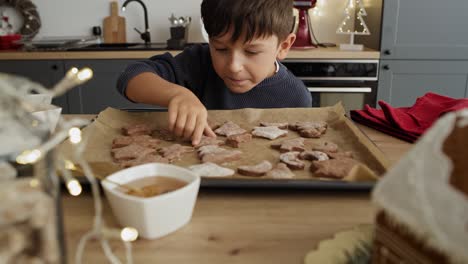 Video-of-little-boy-stealing-gingerbread-cookies-from-the-table
