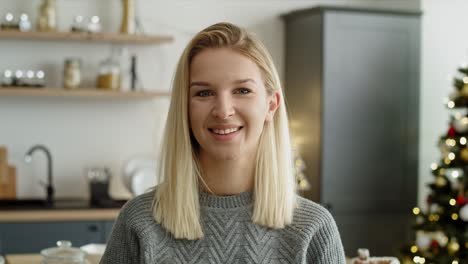 Portrait-video-of-woman-in-the-kitchen-during-Christmas