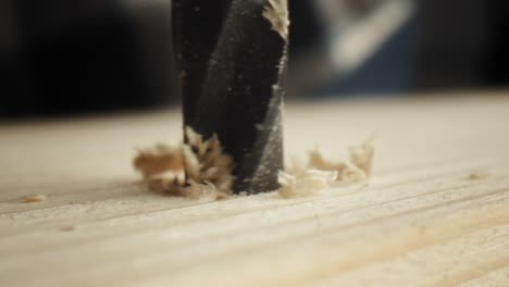 Close-up-static-video-of-drilling-on-wood-plate