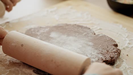 Video-of-girl-making-gingerbread-pastry-with-rolling-pin.