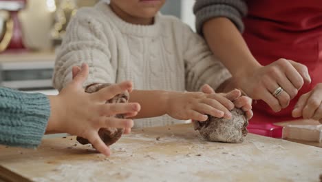 Handheld-video-of-children-preparing-cookies-with-gingerbread-pastry