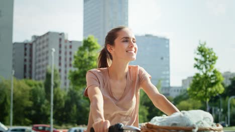 Video-of-happy-young-woman-going-by-bike