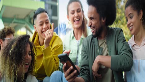 Video-of-happy-group-of-friends-watching-something-on-phone