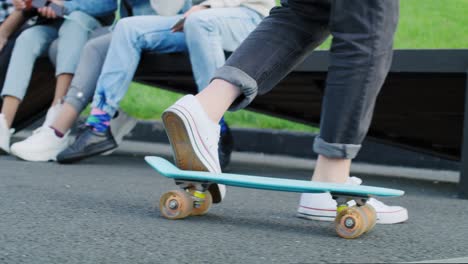 Handheld-view-of-hipster-woman-riding-on-skateboard