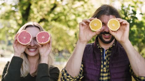 Handheld-view-of-playful-couple-having-fun-with-fruit