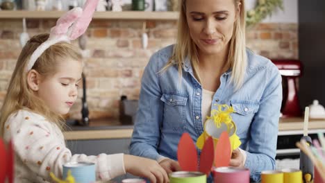Handheld-video-of-mother-and-daughter-preparing-Easter-decorations