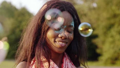 Black-woman-blowing-soap-bubbles-at-the-summer-party