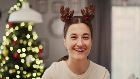 Handheld-video-shows-of-smiling-woman-in-Christmas-time