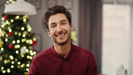 Handheld-view-of-smiling-man-in-Christmas-time