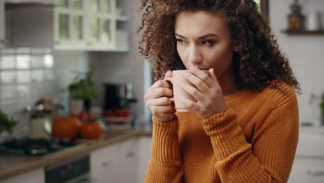 Young-woman-drinking-hot-tea-in-autumn-time/Rzeszow/Poland